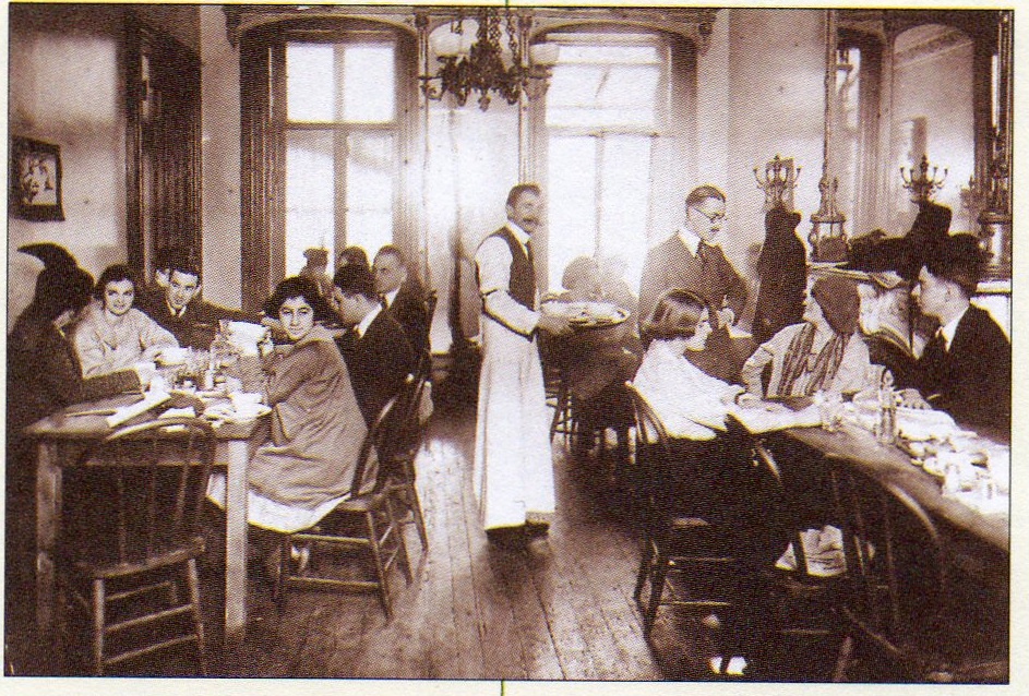 Hippolyte Havel serving tables at his restaurant on MacDougal St., circa 1915