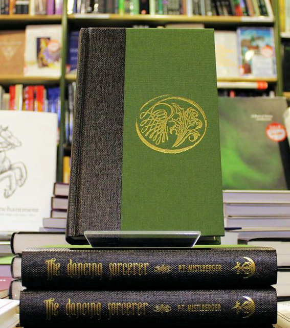 Hardback copies of The Dancing Sorcerer by P.T. Mistlberger, published by Anathema Publishing
