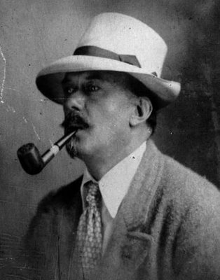 Portrait of Aleister Crowley with a pipe